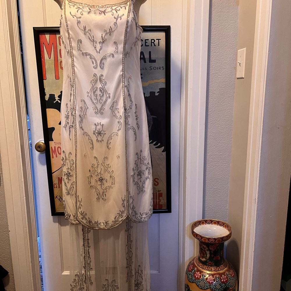 Beaded evening dress with floor length netting